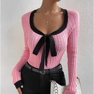 Cute pink sweater with black bow